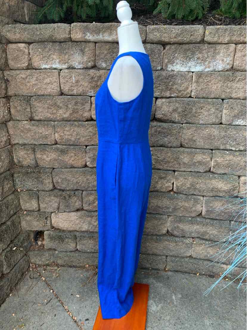 Sleeveless royal blue jumpsuit with fitted waist and wide-leg pants on mannequin.