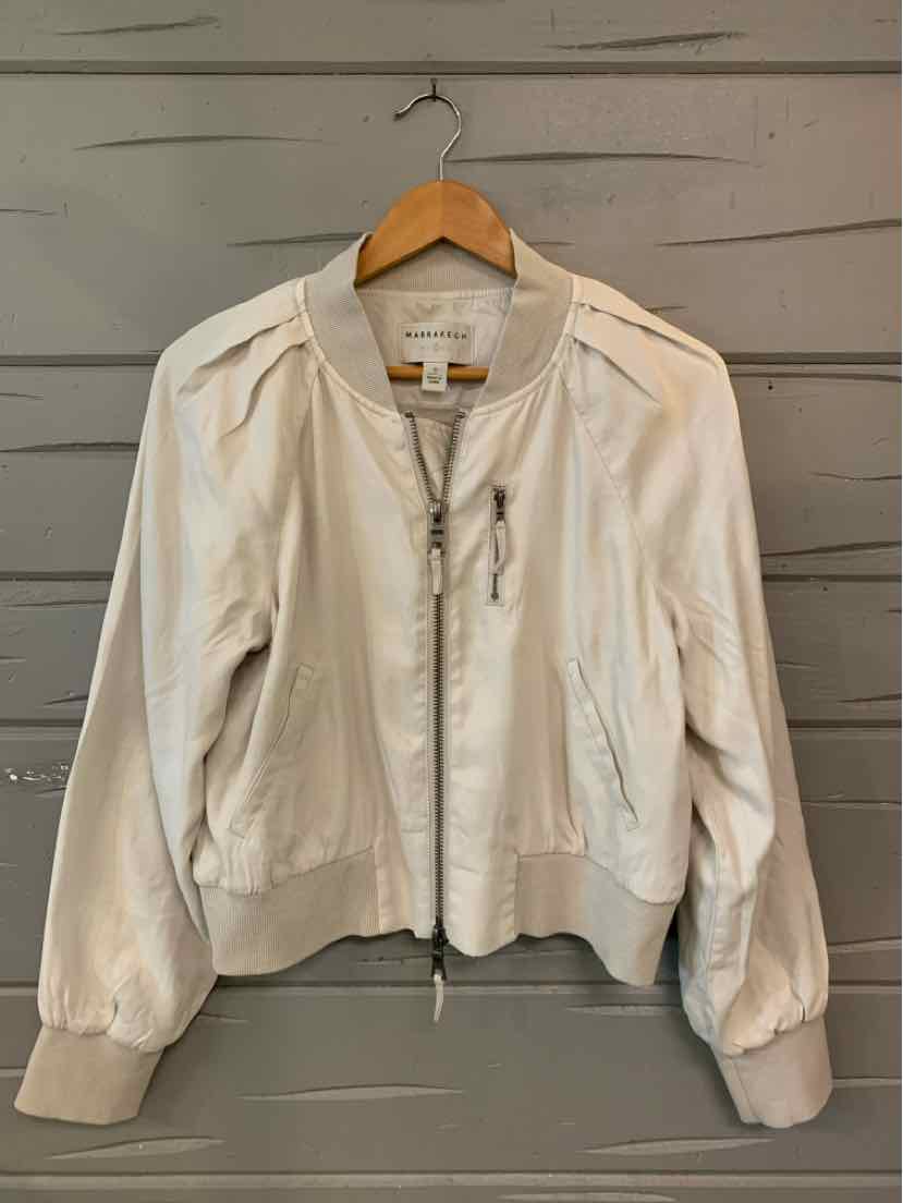 Light sand-colored bomber jacket with ribbed cuffs and waistband, front zip closure, and zippered chest pocket.