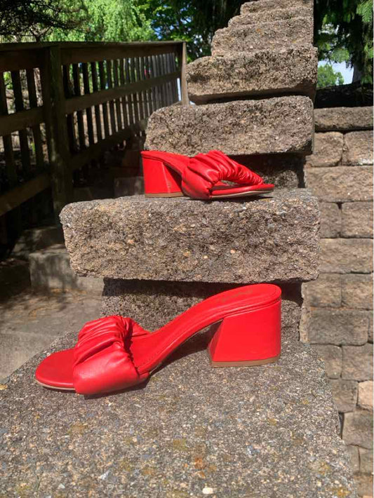 Red block-heel mule with twisted strap detail and square toe in size 7.