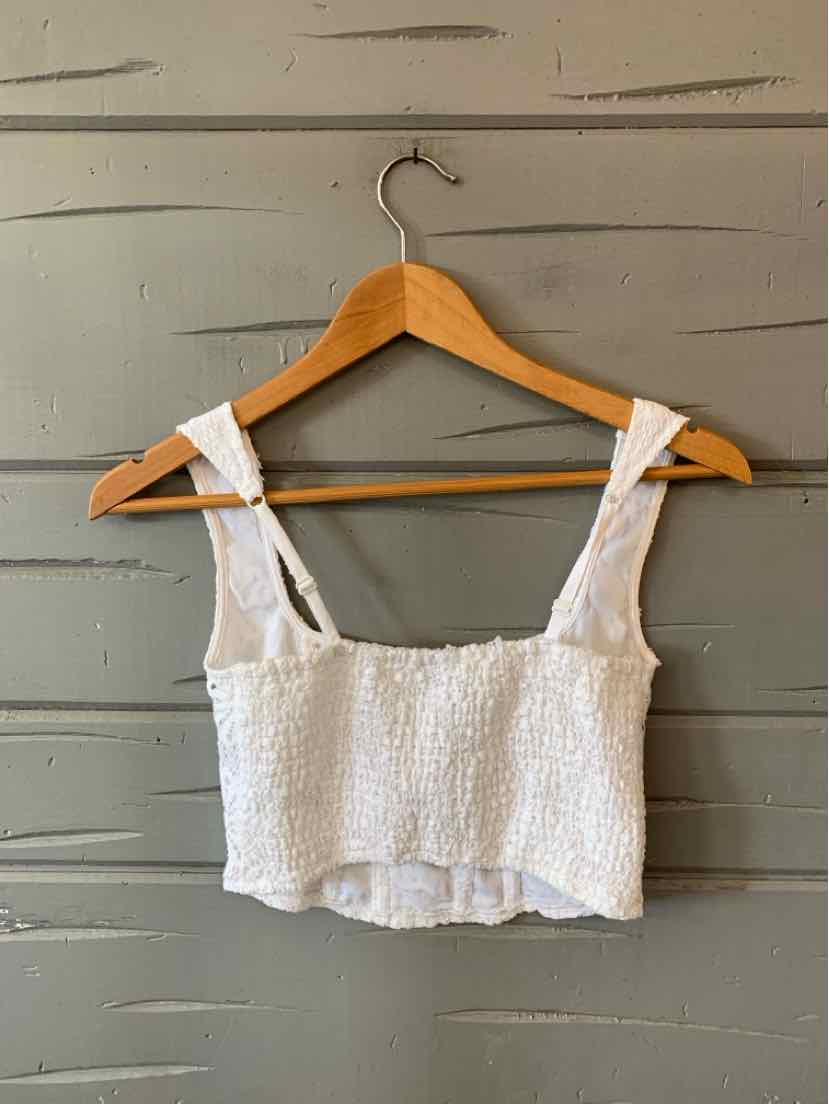 White lace cropped tank top with wide straps and textured fabric, size XS.