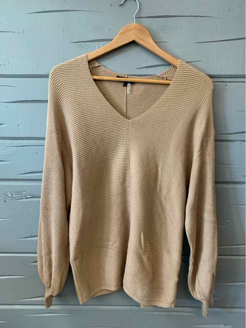 Tan V-neck long-sleeve knit sweater in size small hanging on wooden hanger.