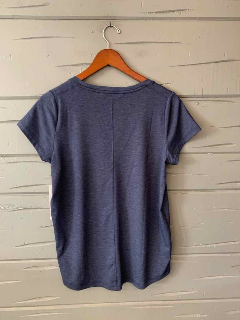 Navy blue short-sleeve athletic top with crew neckline and curved hem on wooden hanger.