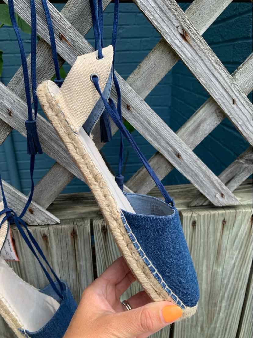 Blue denim espadrille with jute sole and navy ankle tie straps, size 9.5 Women's shoe.