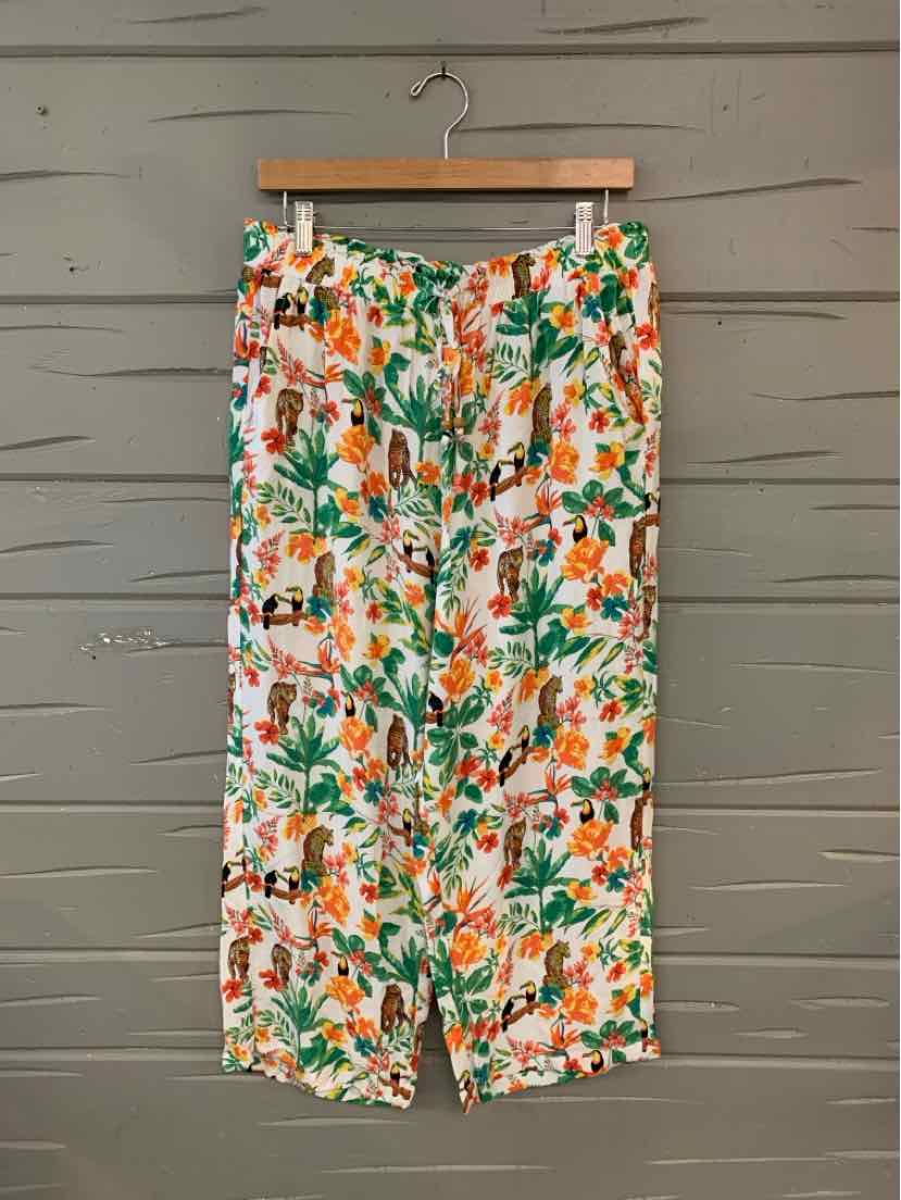 Lightweight wide-leg pants with vibrant orange and green floral print on white background.