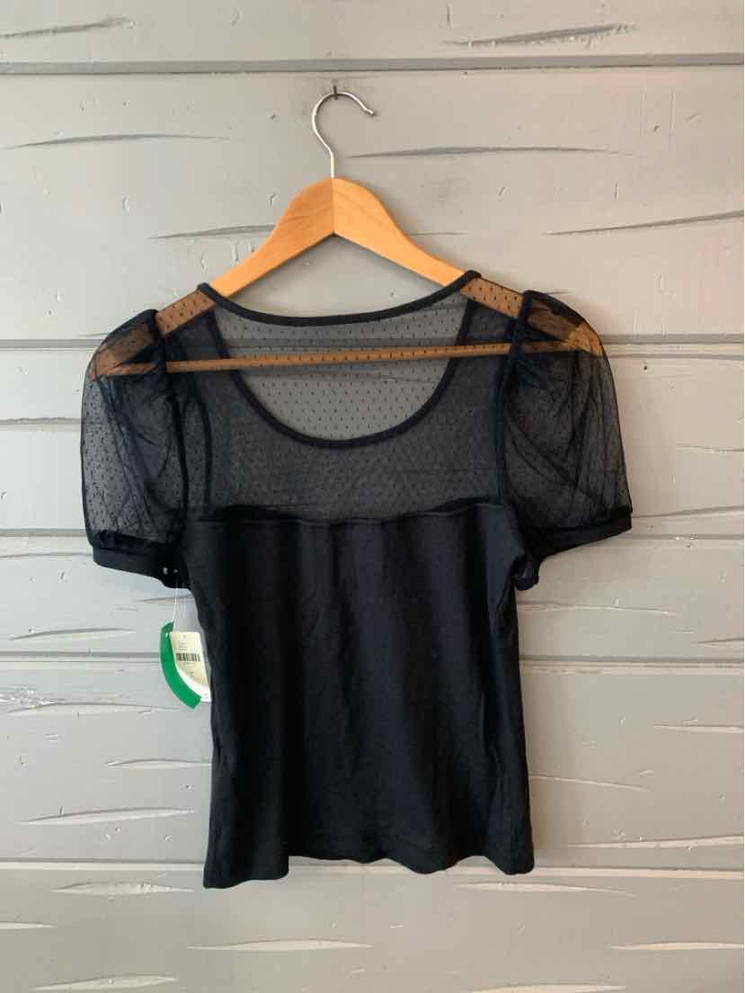 Black short-sleeve top with sheer lace upper and puffed sleeves on wooden hanger.