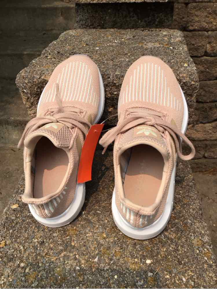 Tan Adidas sneakers in size 5.5 with ribbed fabric upper and white sole, laced closure.