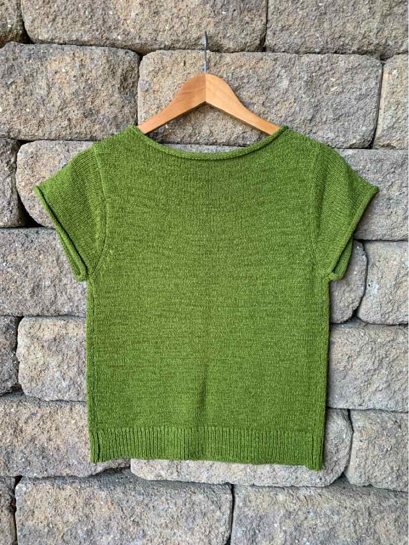 Green marled knit short-sleeve sweater with a wide round neckline, displayed on a wooden hanger.