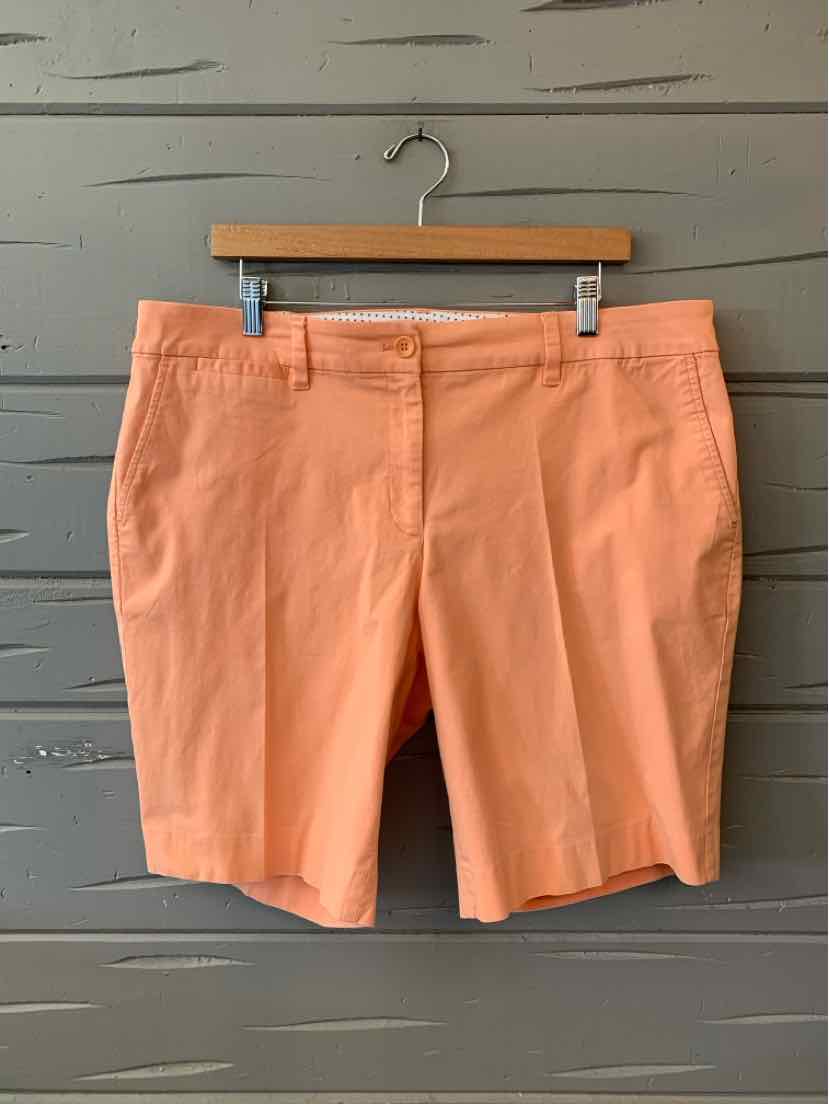Coral solid cotton shorts with front pockets and a button closure, size 16.