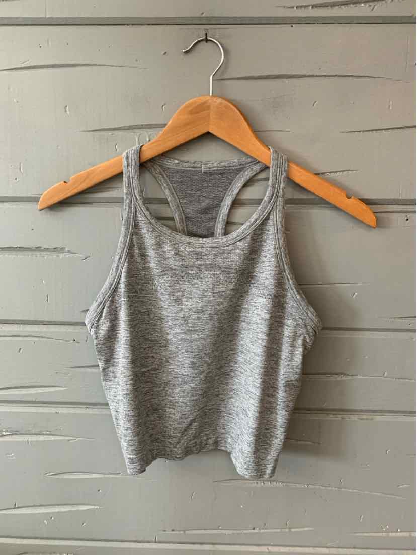 Heather gray cropped athletic tank top with thin straps and racerback on wooden hanger.