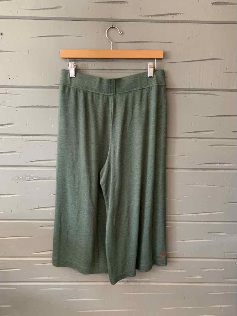 Olive green wide-leg cropped pants with elastic waistband and soft fabric.