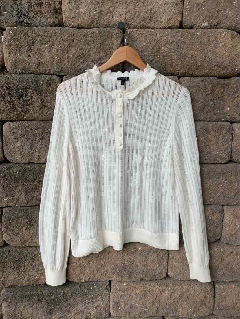 Cream ribbed knit long-sleeve sweater with ruffled collar and button-down front.