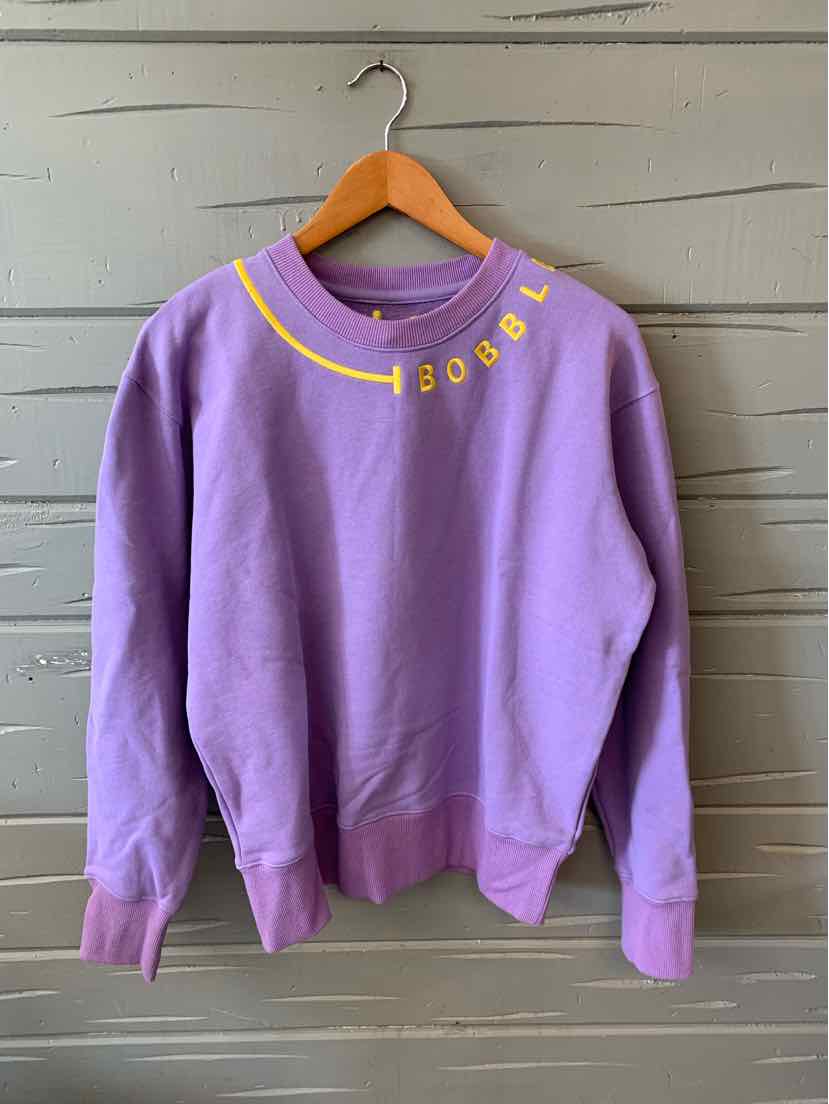 Lavender crewneck sweatshirt with yellow "BOBBLE" text curved along the neckline, ribbed cuffs and hem.