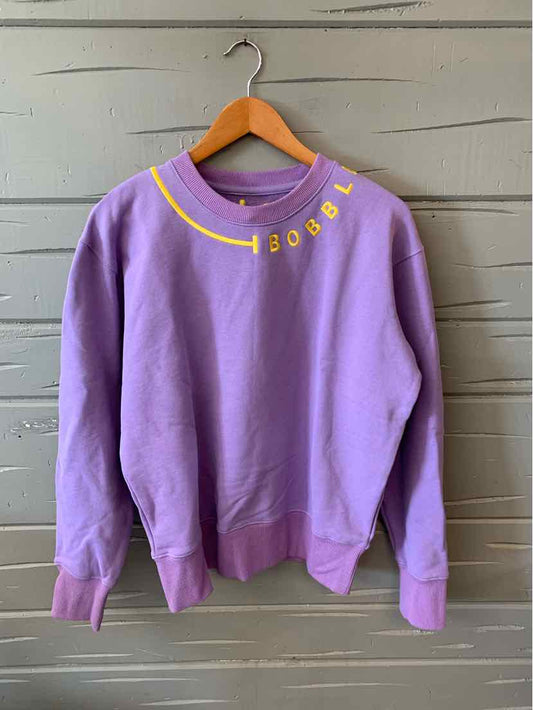 Lavender crewneck sweatshirt with yellow "BOBBLE" text curved along the neckline, ribbed cuffs and hem.