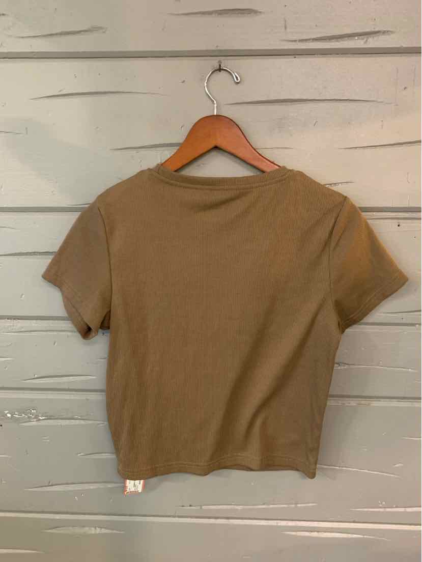 Tan ribbed short-sleeve crop top with crew neckline on a wooden hanger.
