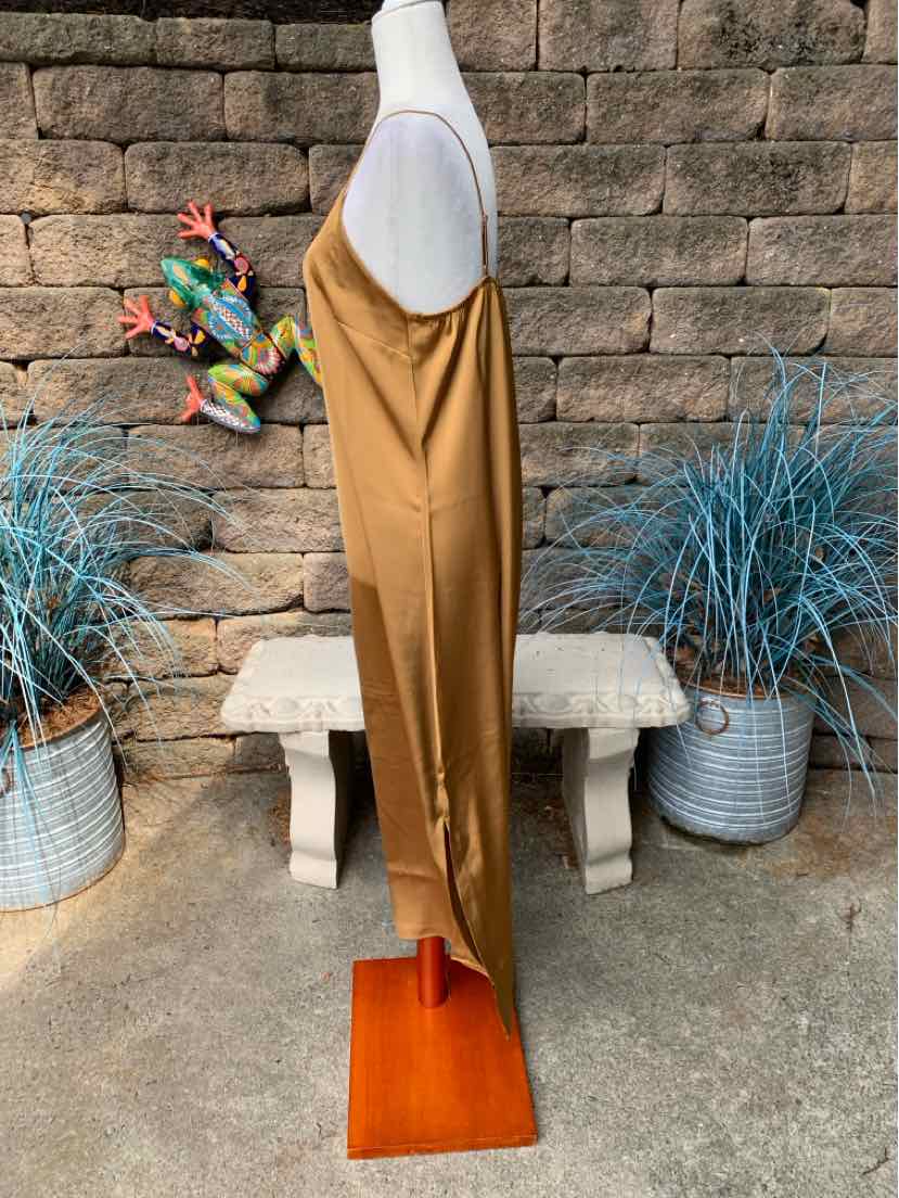 Tan sleeveless midi dress with a straight silhouette and spaghetti straps.