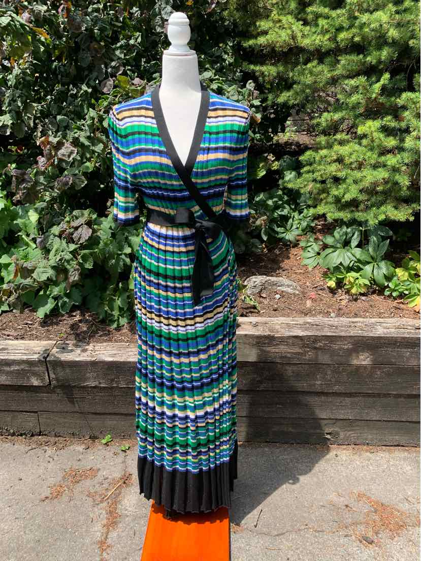 Blue and green striped wrap dress with black trim and pleated hem, midi length.