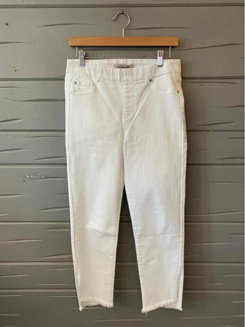 White high-waisted denim jeans with raw hem and classic five-pocket design hanging on wooden hanger.
