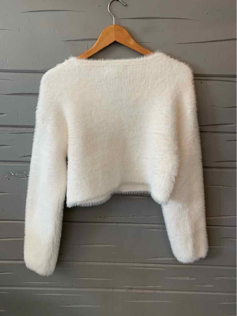 White fluffy cropped sweater with long sleeves and crew neckline, size XS.