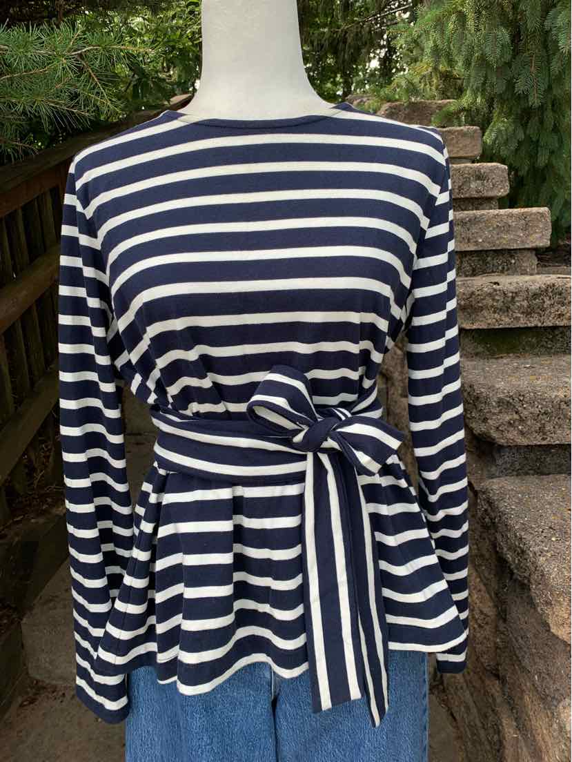 Navy and white horizontal striped long-sleeve top with waist tie and peplum hem.