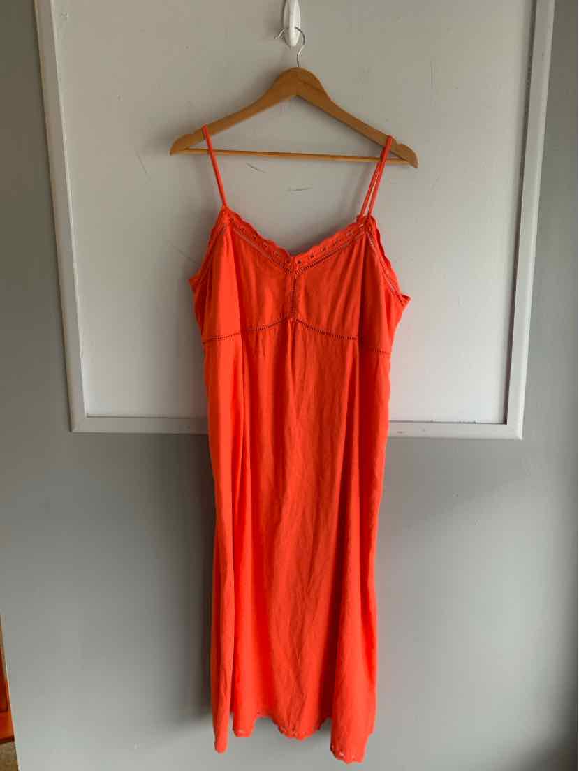 Bright orange sleeveless maxi dress with thin adjustable straps and a v-neckline.