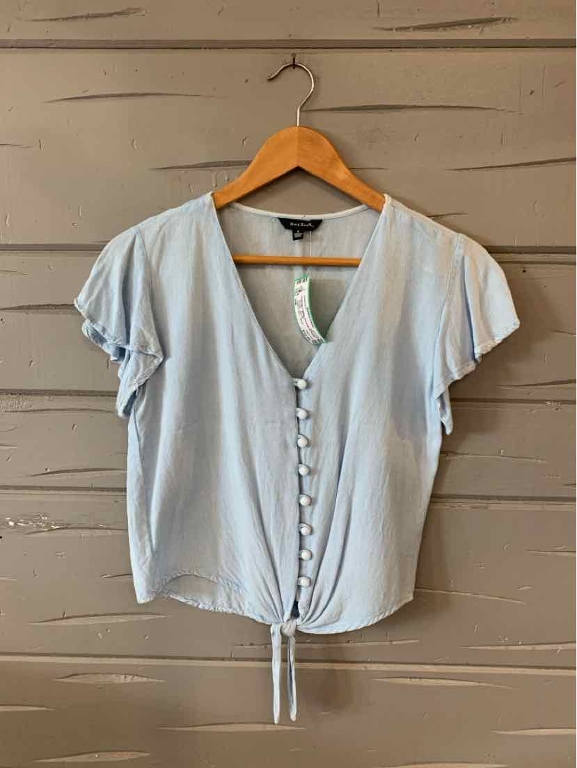 Light blue short-sleeve blouse with button front and gathered puff sleeves on wooden hanger.