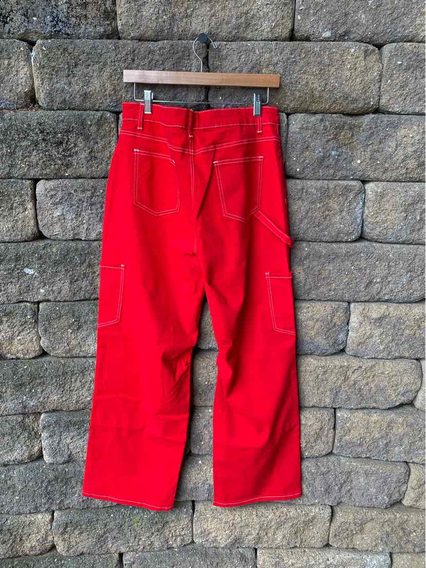 Bright red wide-leg pants with back pockets and side cargo pockets, size 14.