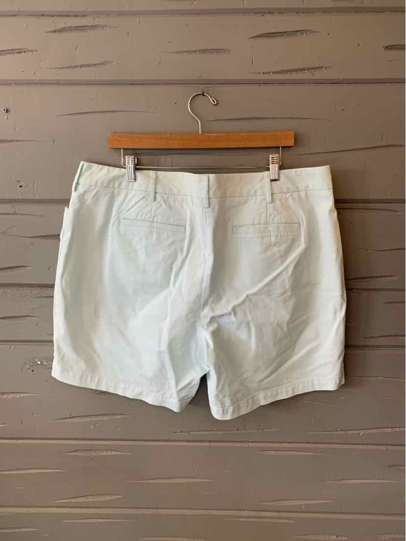 White Lands End shorts size 16W with back pockets and belt loops on wooden hanger.