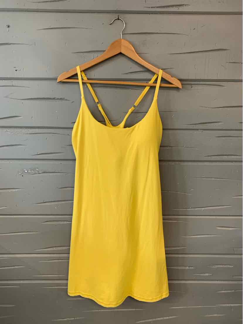 Yellow sleeveless mini dress with thin double straps and a smooth, solid fabric.