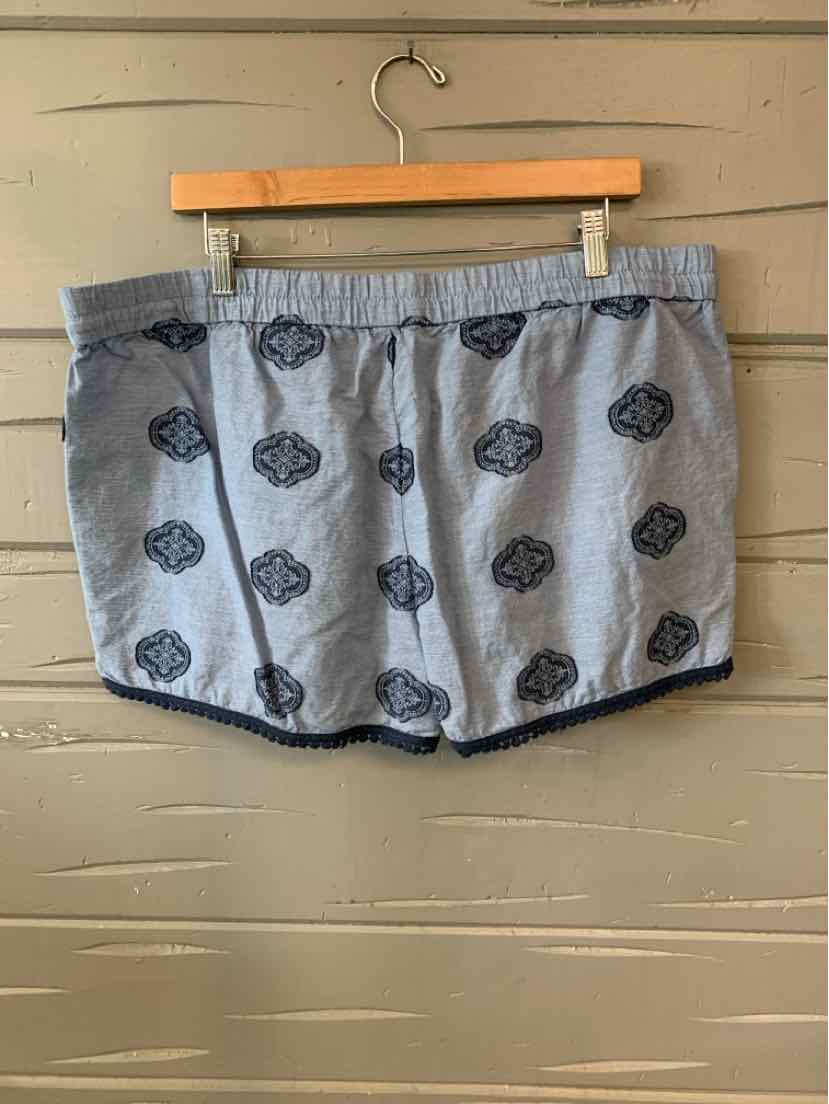 Gray athletic shorts with black floral patterns and elastic waistband, size XL.