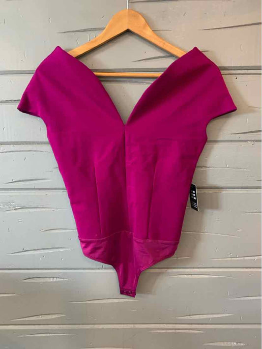 Fuchsia off-shoulder bodysuit with deep V neckline and fitted waist on wooden hanger.