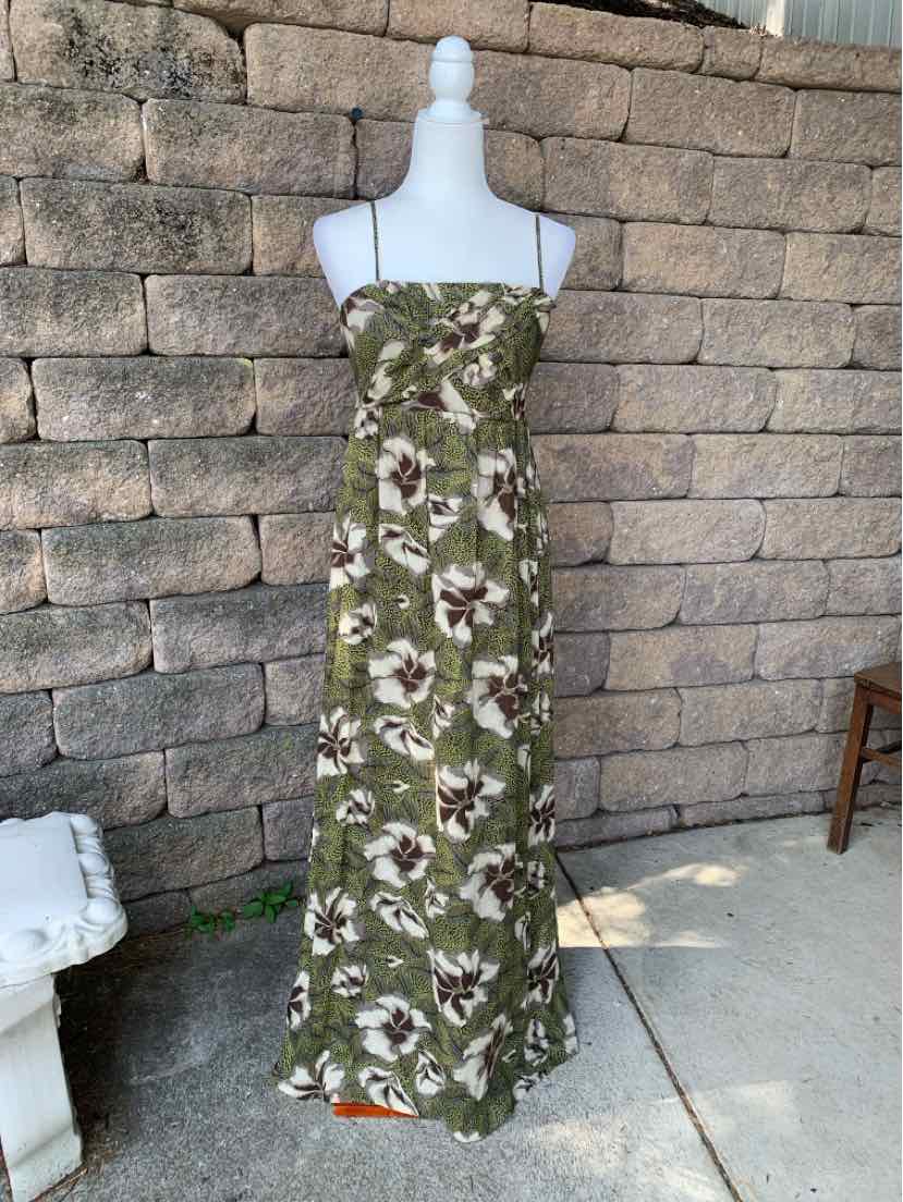 Green floral maxi dress with thin spaghetti straps and fitted bodice.