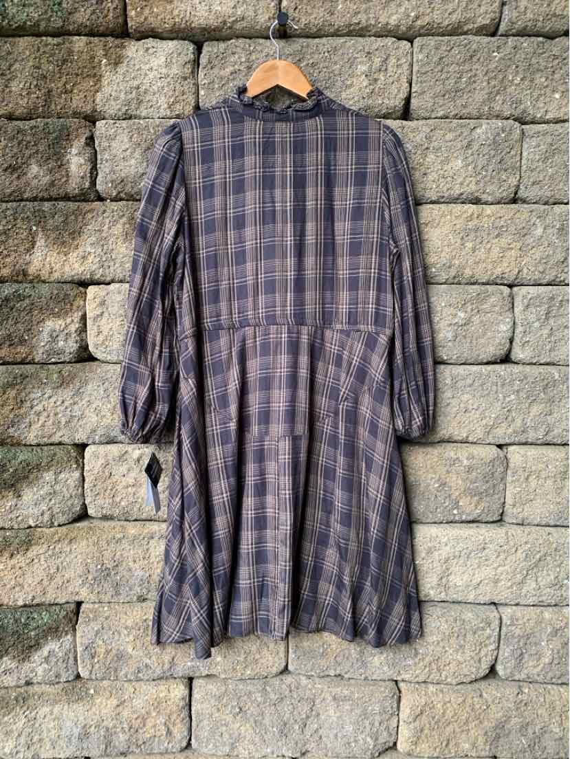 Gray plaid long-sleeve dress with high neckline and gathered waist, flowing skirt.