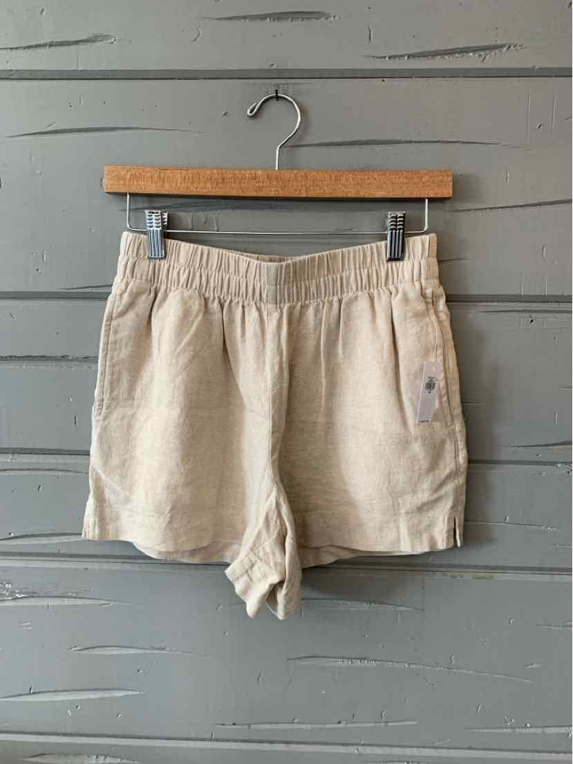 Tan cotton blend shorts with elastic waistband and side pockets, size XS.