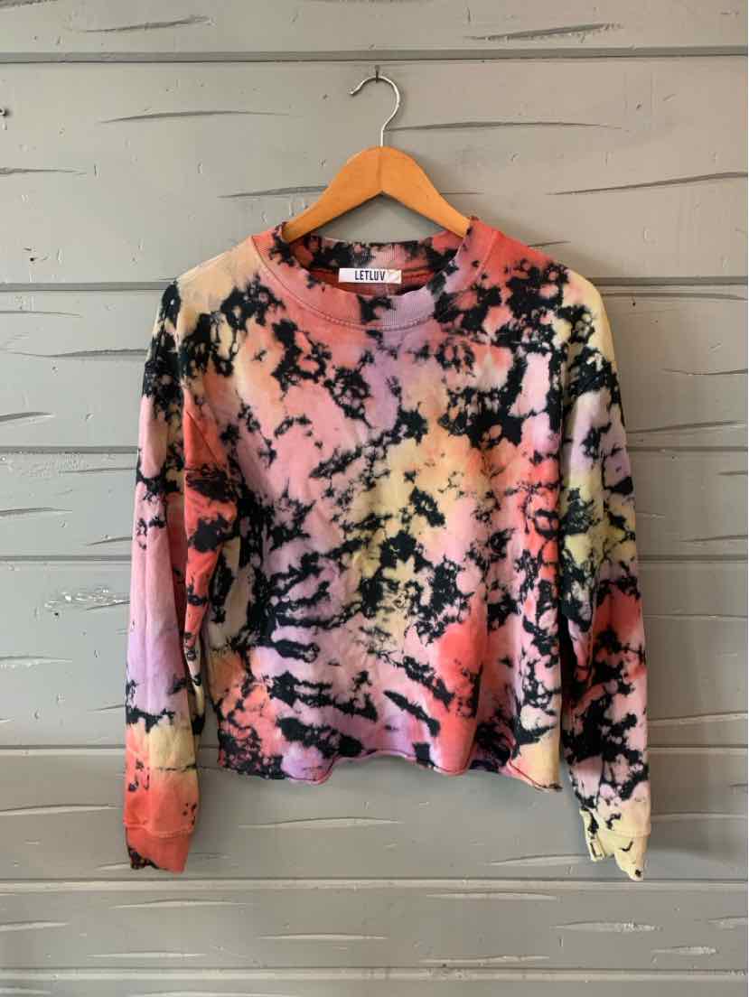 Long-sleeve tie-dyed shirt in soft pastel shades of pink, peach, yellow, and black on lightweight fabric.