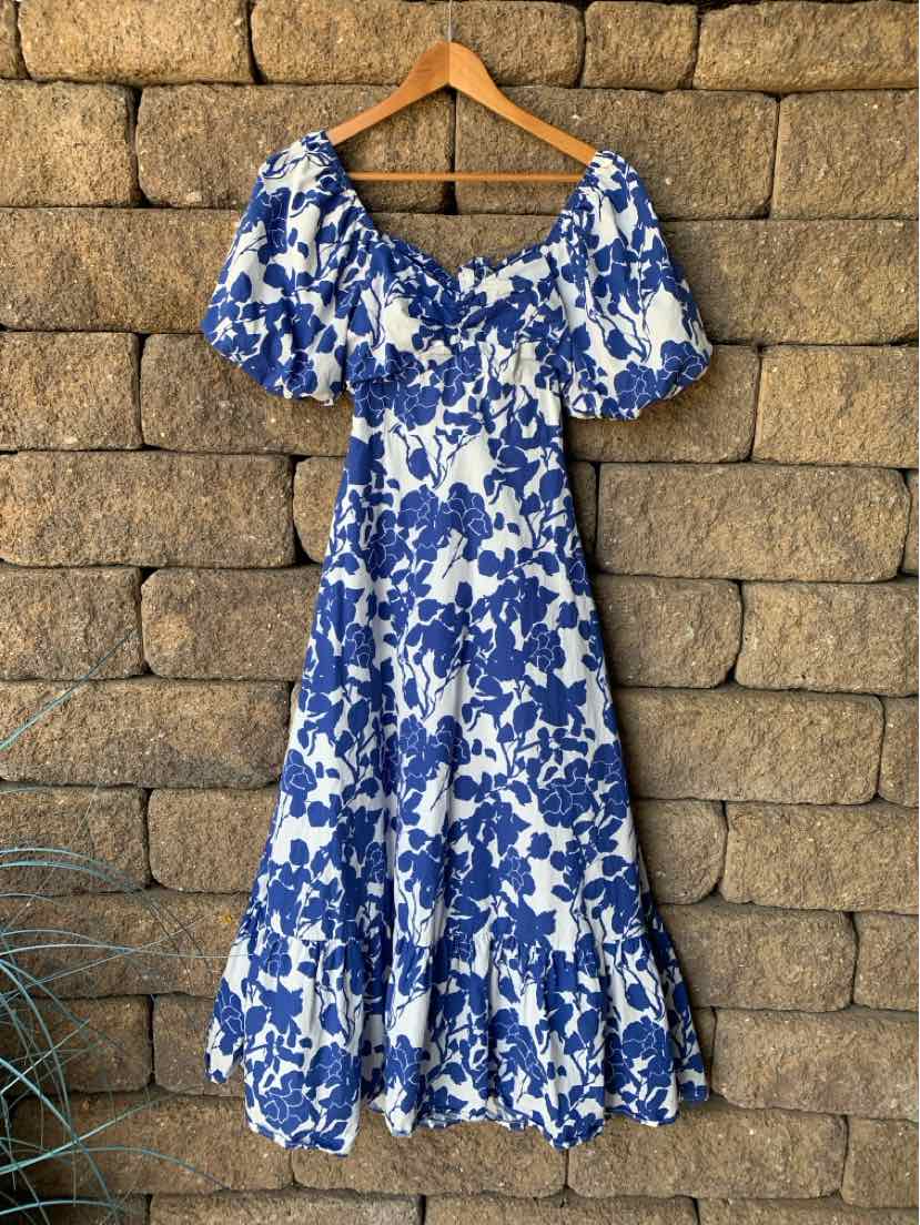 Blue and white floral off-shoulder dress with puff sleeves and ruffled hem, size XS.