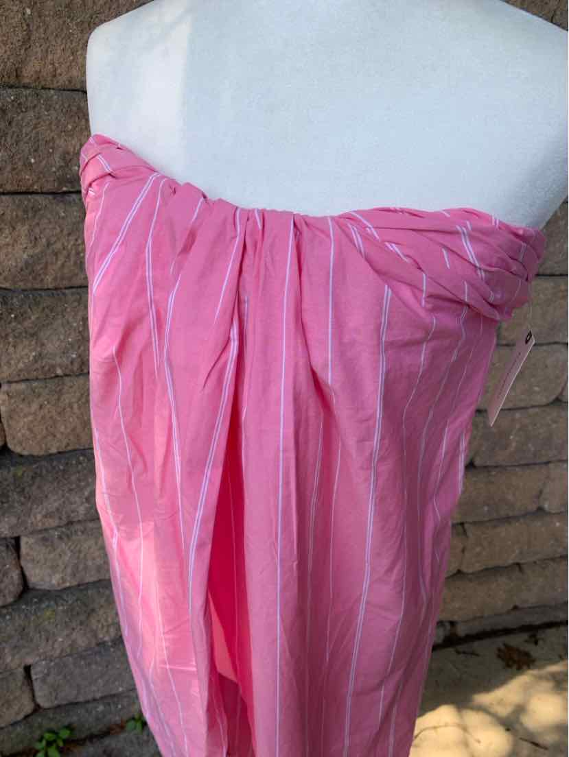 Pink strapless dress with ruched detailing and subtle vertical stripes on lightweight fabric.