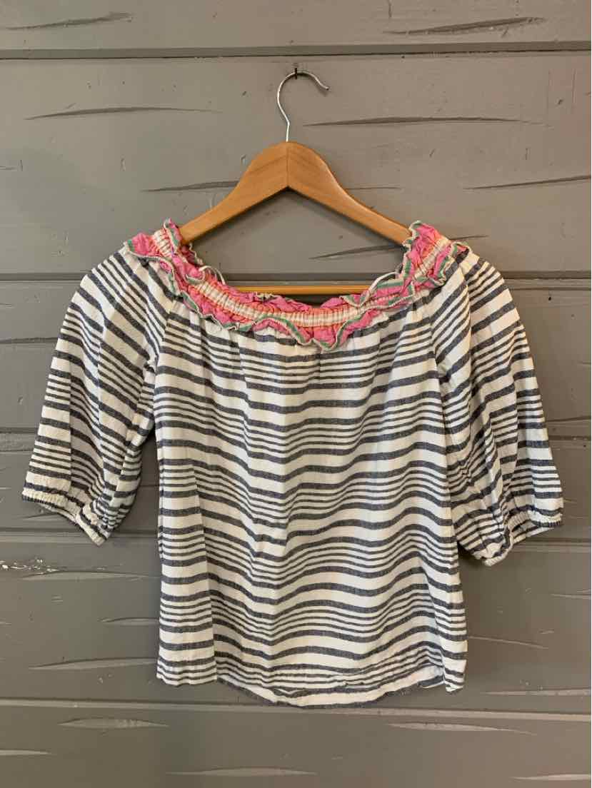 Gray and white striped top with pink ruffle neckline and elbow-length sleeves hanging on wooden hanger.