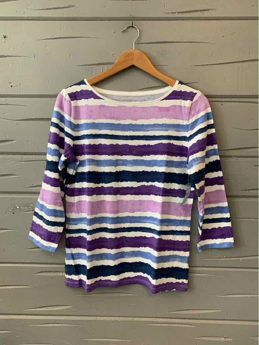 Long-sleeve knit top with horizontal stripes in purple, white, navy, and black on wooden hanger.