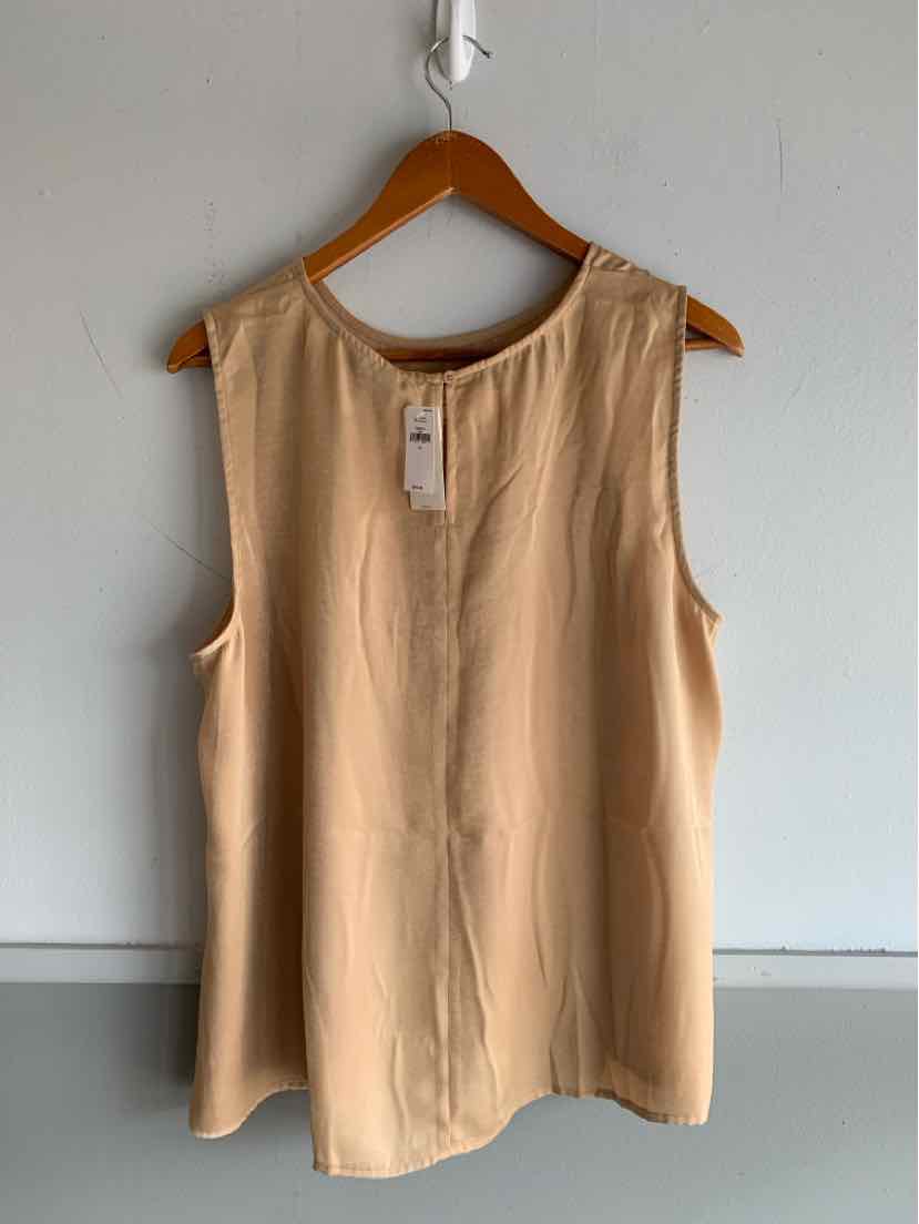 Sleeveless beige blouse with round neckline and back keyhole detail on wooden hanger.