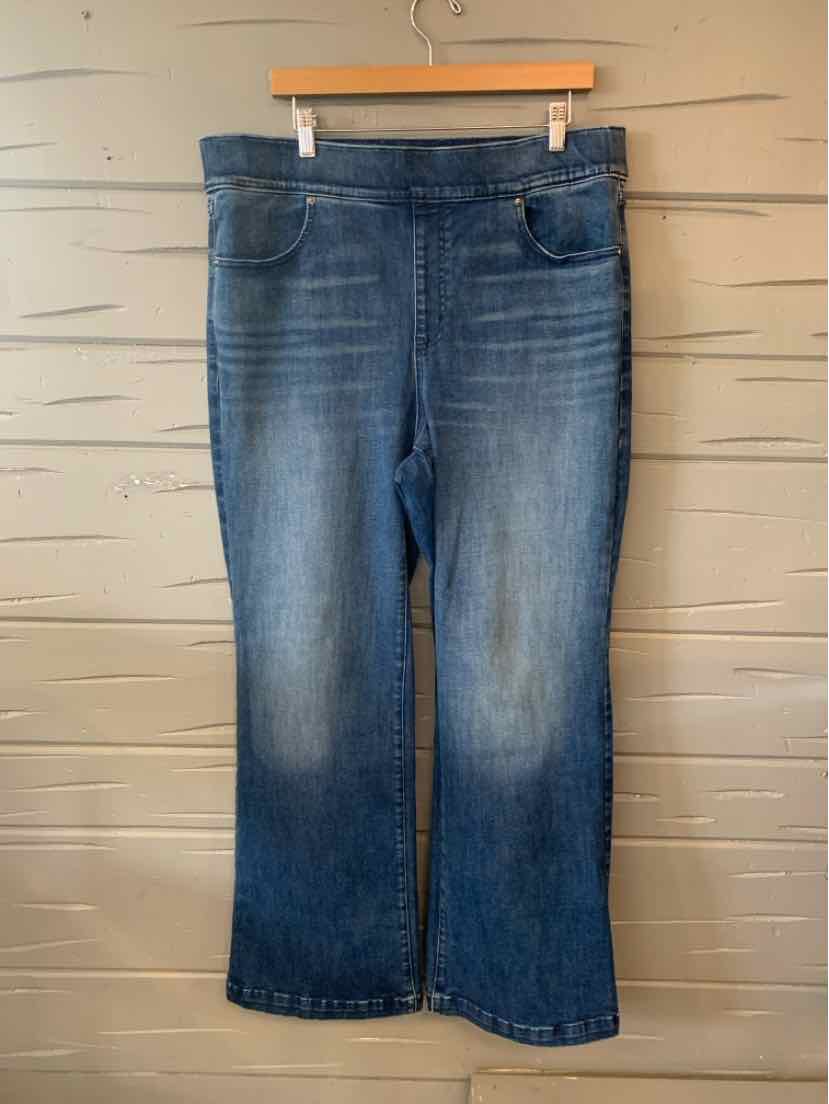 Blue denim bootcut jeans with subtle fading, mid-rise waist, and classic five-pocket design.