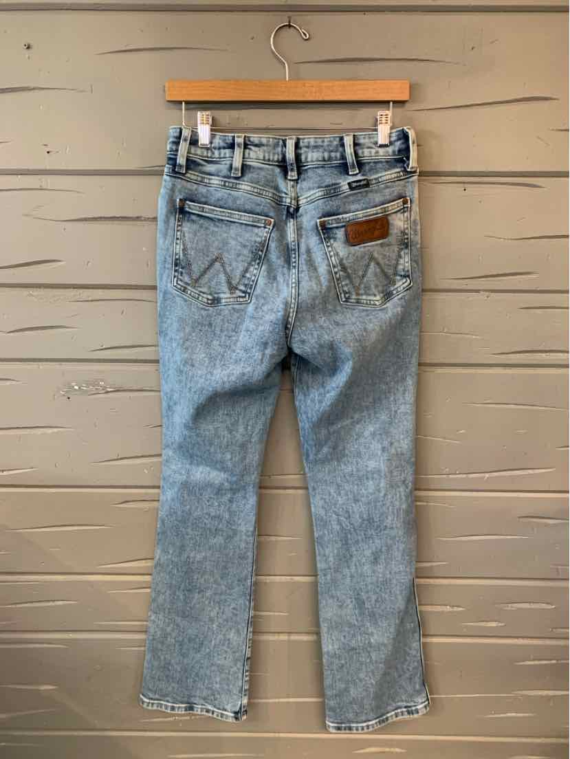Light blue high-waist denim jeans with straight legs and leather patch on back waistband.