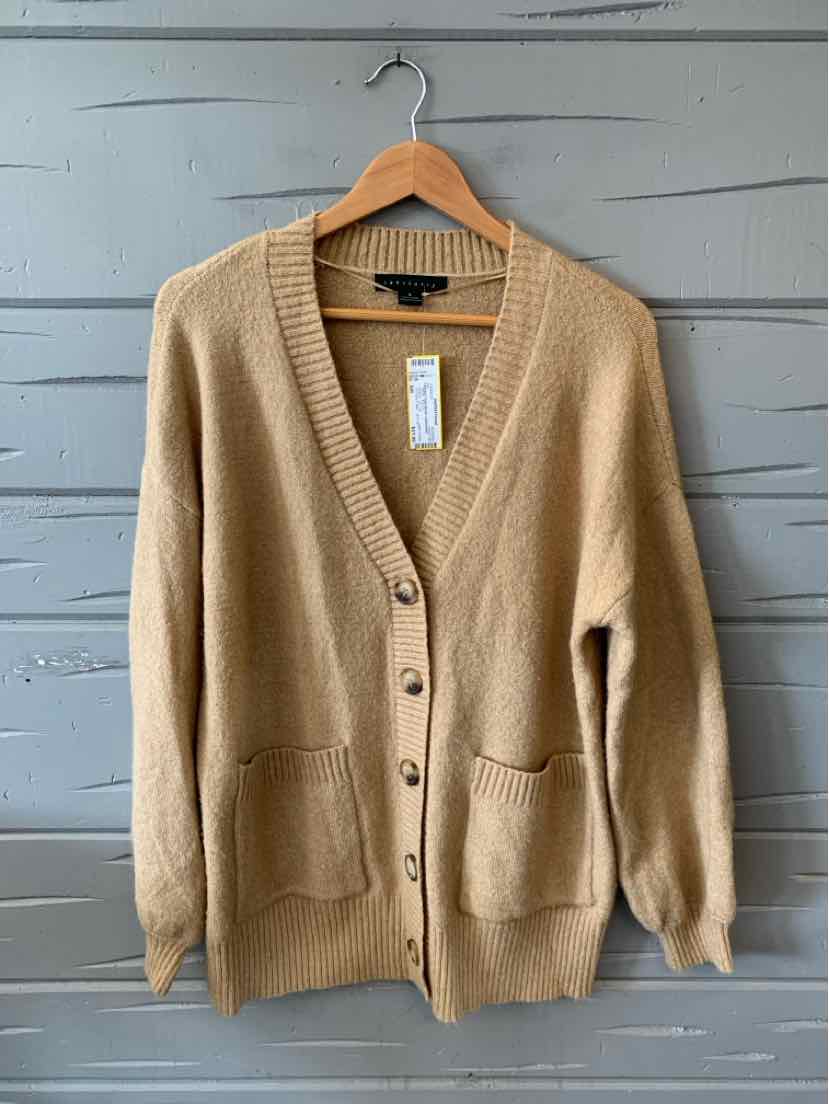Tan knit cardigan with long sleeves, V-neck, button front, and two front pockets.