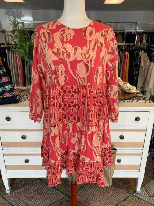 Red and pink floral pattern dress with long sleeves and a cinched waist detail in medium size.