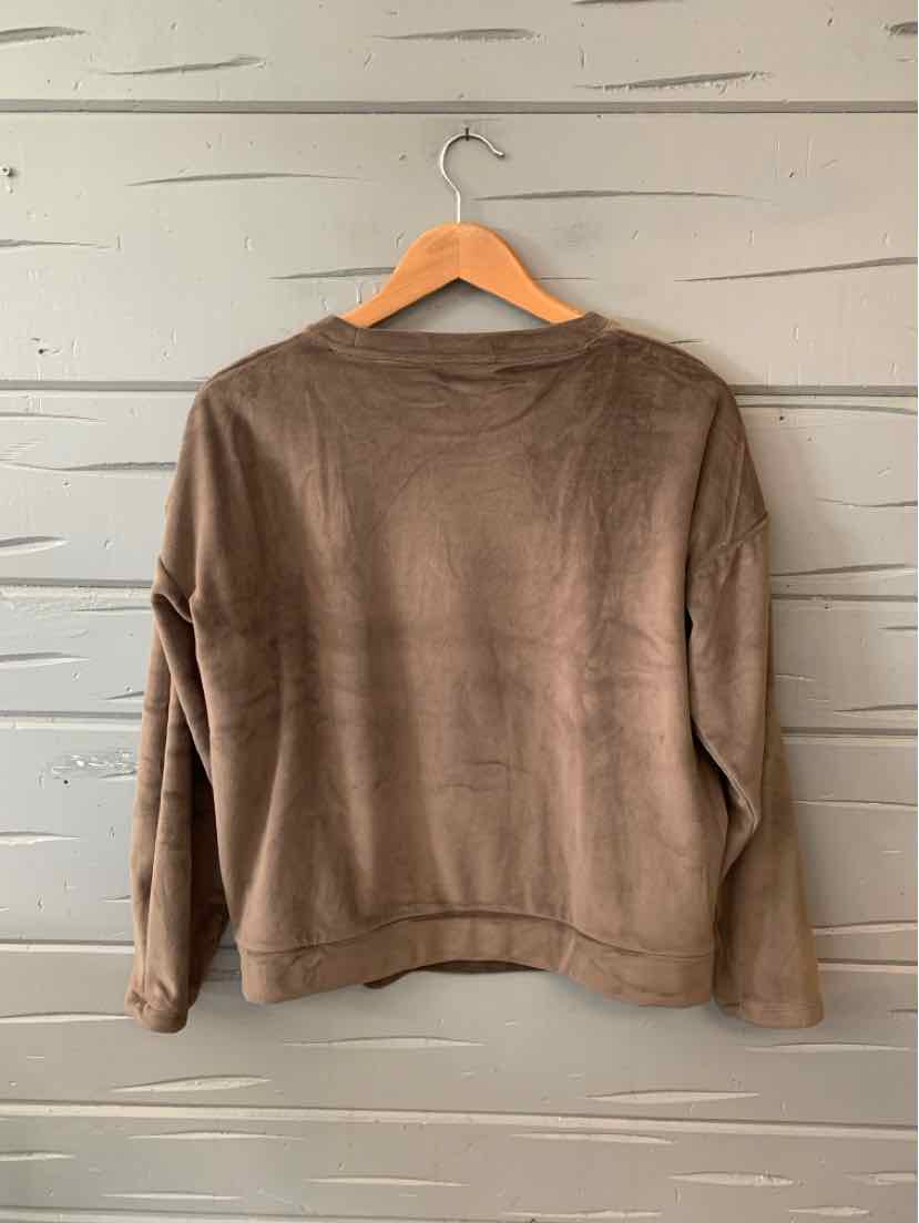 Brown long-sleeve crewneck sweater in soft fabric hanging on wooden hanger.