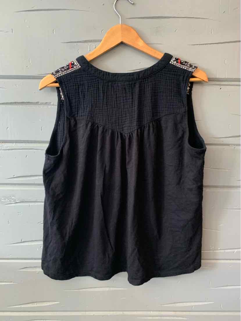 Black sleeveless blouse with embroidered shoulder details and a loose, flowy fit.