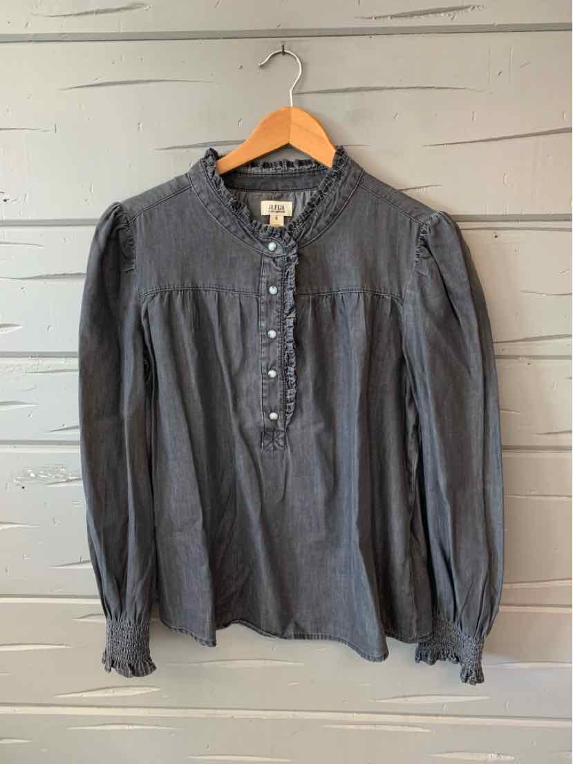 Dark gray long-sleeve blouse with ruffled collar and buttoned front placket.