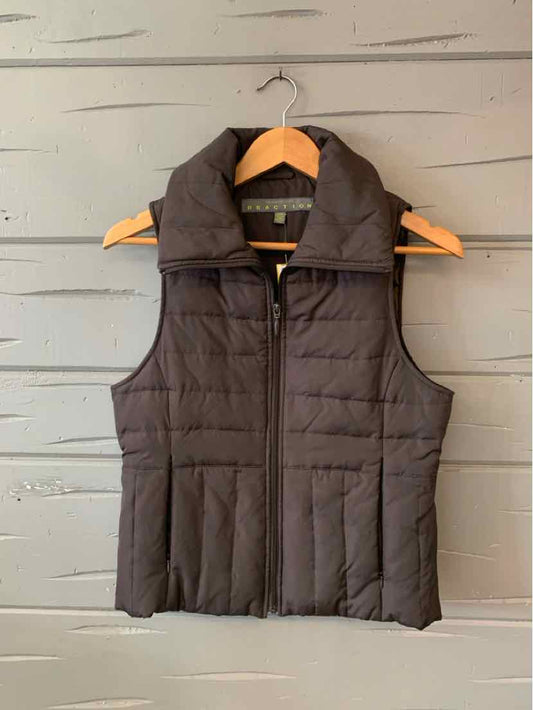 Black quilted sleeveless puffer vest with high collar and front zipper closure.
