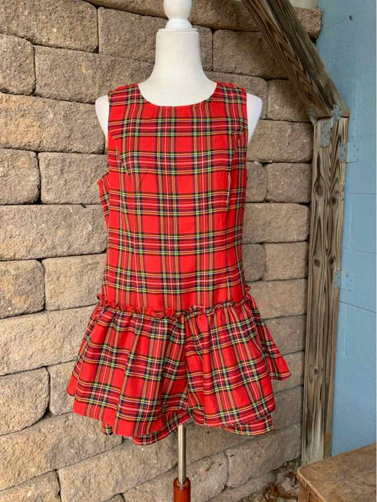 Red and green plaid sleeveless dress with a fitted bodice and gathered skirt.