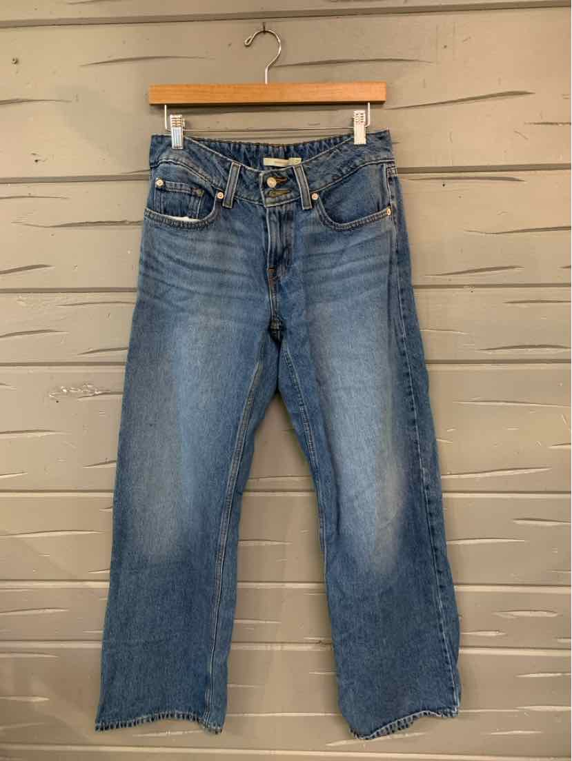 Blue high-waist Levi's denim jeans in size 4 with button fly and straight leg cut.