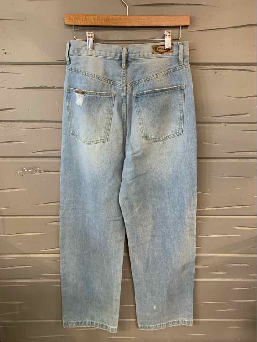 Light blue denim jeans with a relaxed fit, back patch pockets, and subtle fading details.